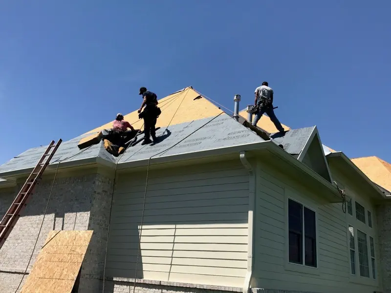 Roofers on a fresh roof deck